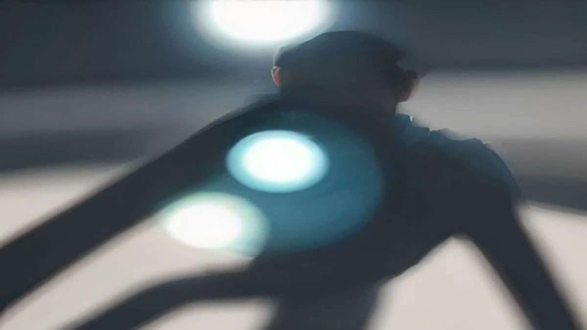slight low angle of a quality inspector in a clean facility holding a magnifier over a manufactured part, soft morning light